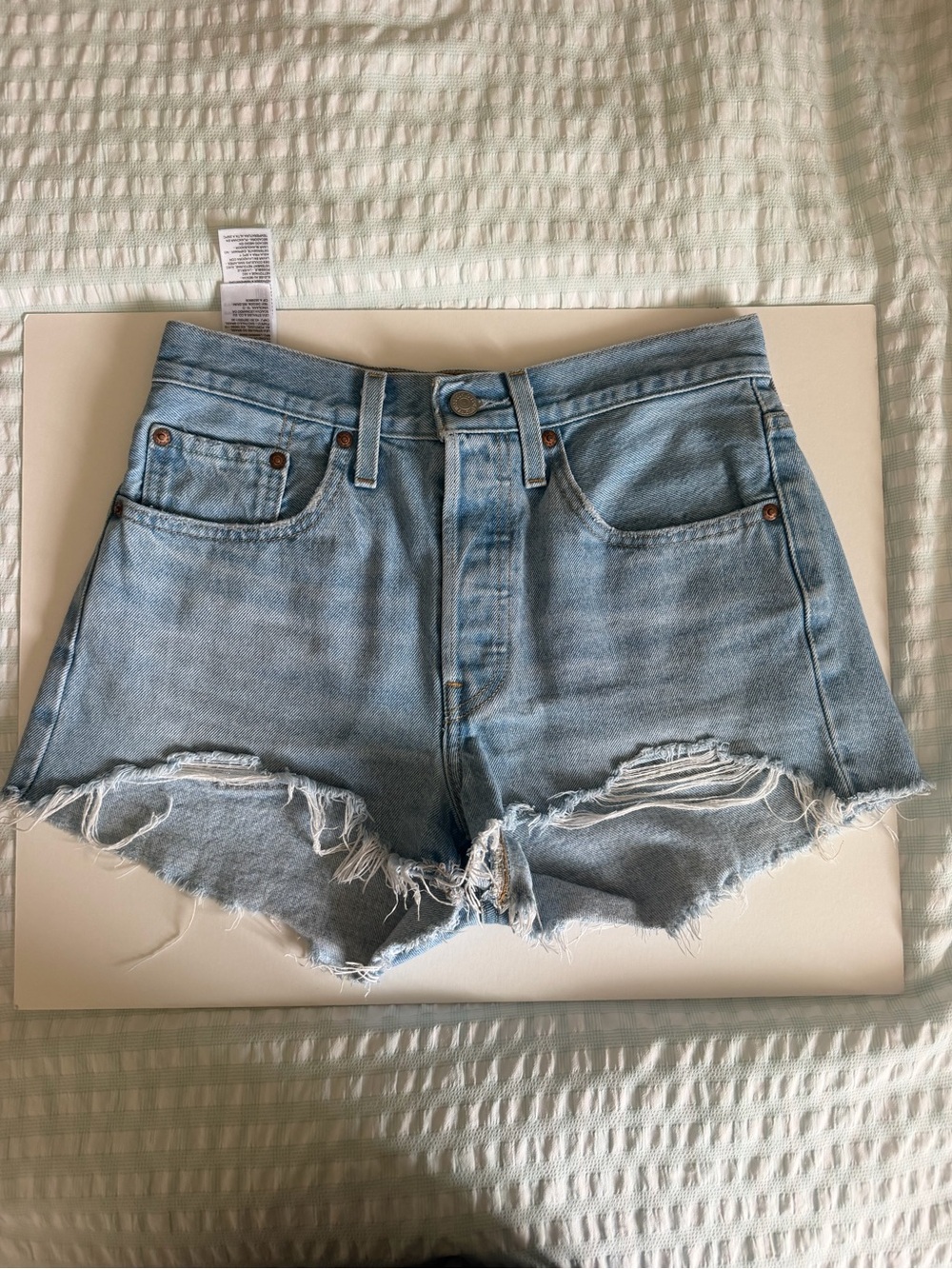 Levi's 501 High-Rise Light Blue Distressed Denim Shorts